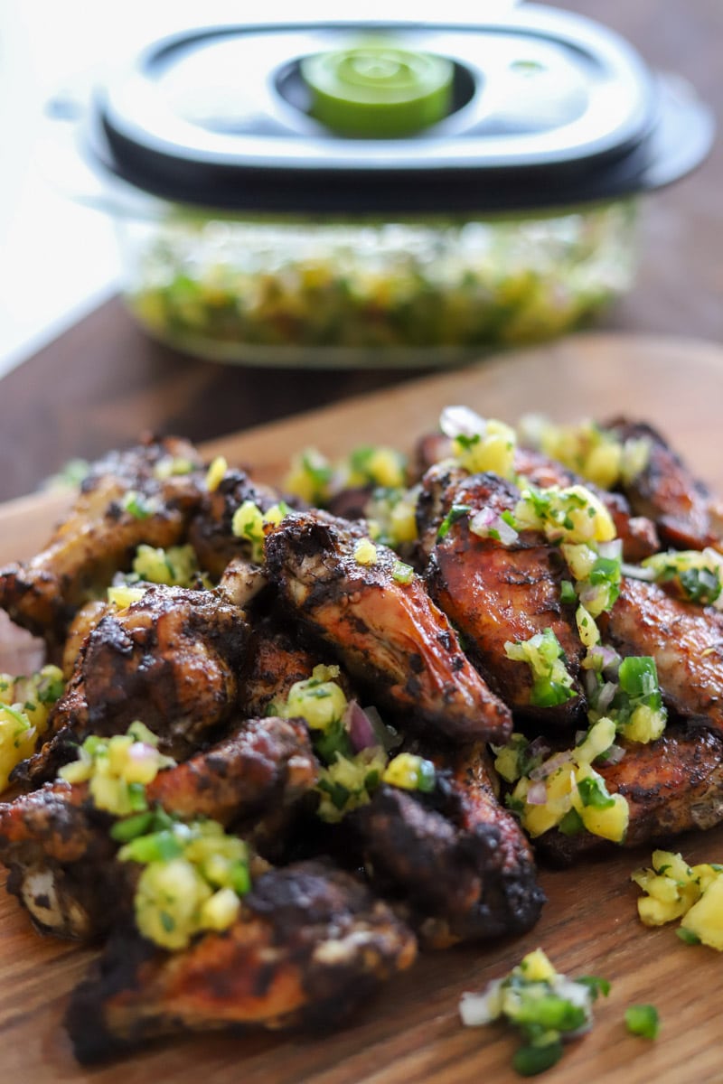 jerk chicken wings topped with pineapple salsa