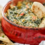 spinach dip in red bowl