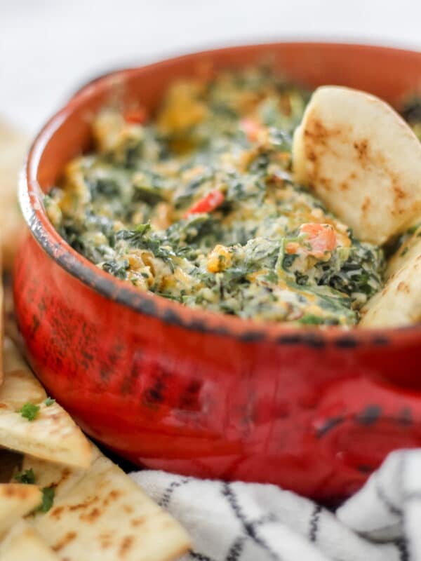 spinach dip in red bowl