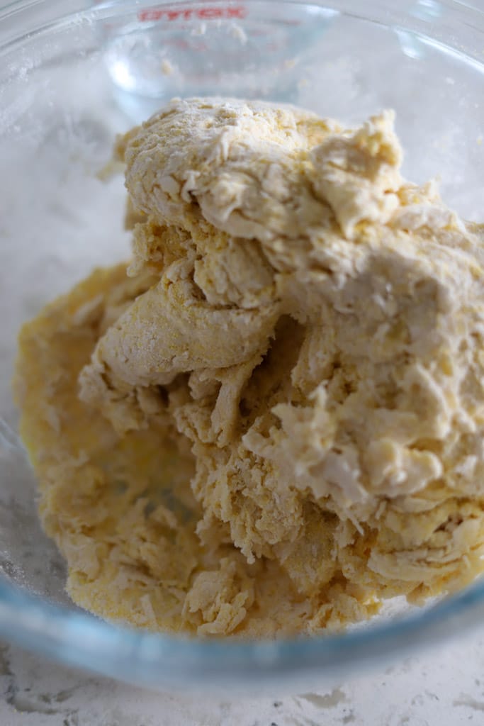 Close-up of rough-textured dough after mixing.