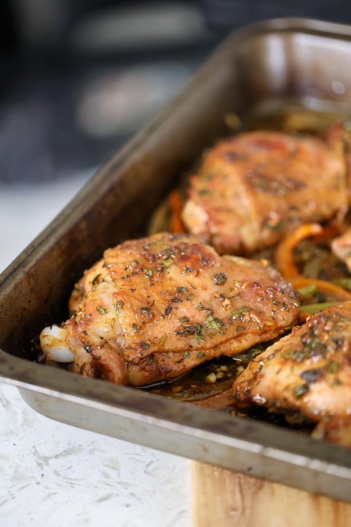 Roasted turkey thighs with caramelized edges served in a pan.