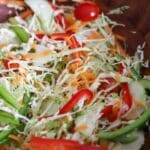 close up view of a bowl of cabbage salad