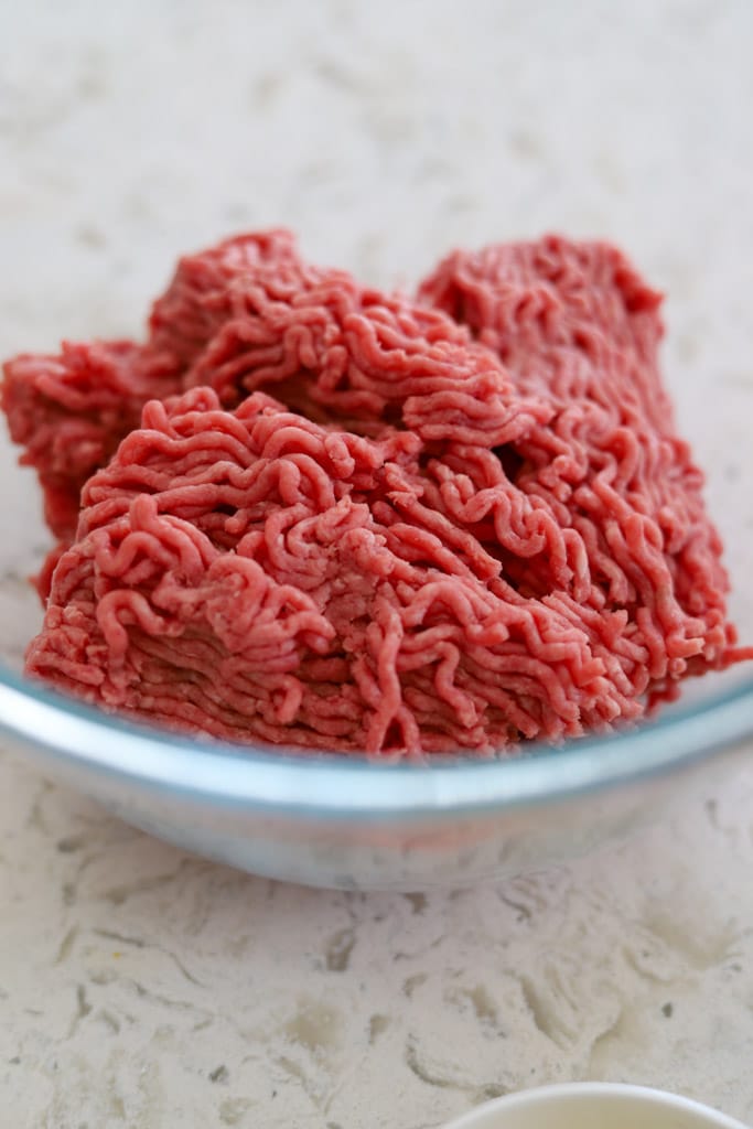 raw ground beef in bowl.