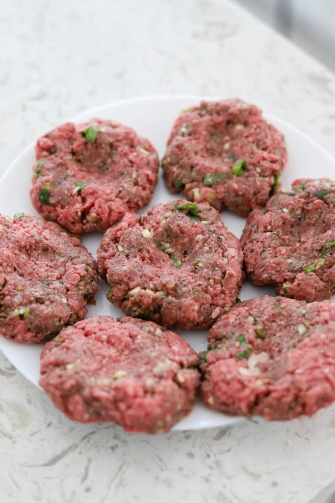 raw jerk burger patties.