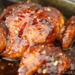 Whole spatchcock chicken roasted and coated in glossy sweet chili glaze.