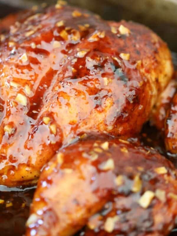 Whole spatchcock chicken roasted and coated in glossy sweet chili glaze.